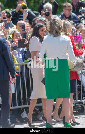 Chester, UK. 14th Jun, 2018. Queen & Meghan Markle visit Chester, UK   The Queen goes walkabout and greets Meghan Markle, Duchess of Sussex greets crowds whilst surrounded by photographers and officials during a brief walkabout in Chester. The Queen and Meghan were in the city to officially open the new Storyhouse Theatre.  Picture Credit: Brian Hickey/Alamy Live News Stock Photo