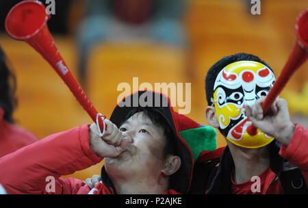 Beijing, South Africa. 2nd July, 2010. Two Chinese fans blow vuvuzelas prior to the 2010 World Cup quarterfinal soccer match between Uruguay and Ghana at Soccer City stadium in Johannesburg, South Africa, July 2, 2010. Credit: Li Ga/Xinhua/Alamy Live News Stock Photo