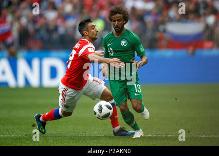 Moscow, Russia. 14th June 2018. Aleksandr Samedov of Russia and Yasser Al-Shahrani of Saudi Arabia during the 2018 FIFA World Cup Group A match between Russia and Saudi Arabia at Luzhniki Stadium on June 14th 2018 in Moscow, Russia. Credit: PHC Images/Alamy Live News Stock Photo