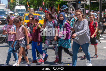 New York, USA. 14th Jun, 2018. Marchers in the annual Flag Day Parade in New York on Thursday, June 14, 2018, starting at New York City Hall Park.  Flag Day was created by proclamation by President Woodrow Wilson on June 14, 1916 as a holiday honoring America's flag but it was not until 1949 when it became National Flag Day.  The holiday honors the 1777 Flag Resolution where the stars and stripes were officially adopted as the flag of the United States. (© Richard B. Levine) Credit: Richard Levine/Alamy Live News Stock Photo