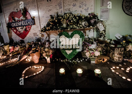 London, UK. 14th June, 2018. The flowers memorial at the foot of the Grenfell Tower.On the first anniversary of the Grenfell Tower fire, which killed 72 people, the area around the tower has been filled with flowers, candles and messages to remember those who lost their lives. Credit: Brais G. Rouco/SOPA Images/ZUMA Wire/Alamy Live News Stock Photo