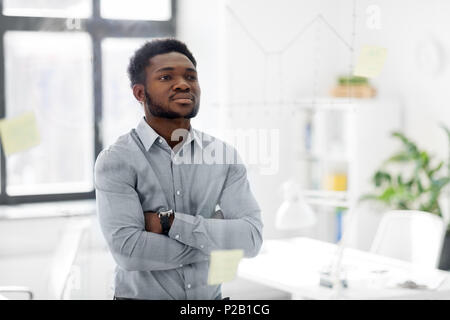 businessman looking at glass board at office Stock Photo