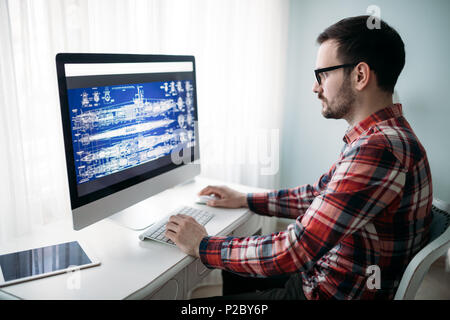Young designer working on project at home Stock Photo