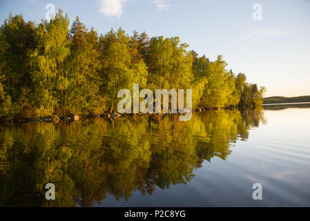 Golden reflection. Lake Kukkia, Luopioinen, Finland.järvimaisema Stock Photo