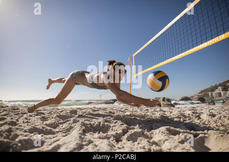 Female volleyball player playing football Stock Photo
