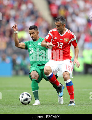 Saudi Arabia's Salem Al-Dawsari (left) and Russia's Aleksandr Samedov battle for the ball during the FIFA World Cup 2018, Group A match at the Luzhniki Stadium, Moscow. Stock Photo