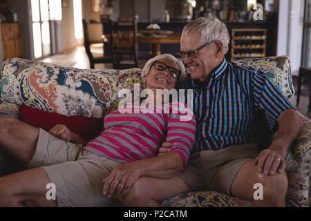 Romantic senior couple having fun in living room Stock Photo