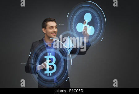 businessman with cryptocurrency holograms Stock Photo