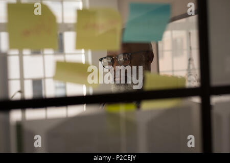 Senior graphic designer working in office Stock Photo