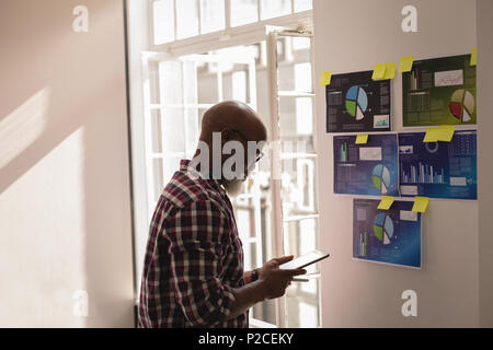 Senior graphic designer using digital tablet Stock Photo
