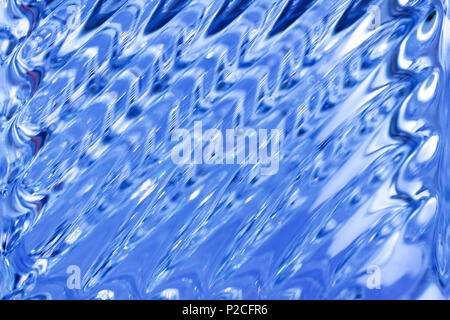 Macro abstract background of beautiful glowing lead crystal glass with diagonal line patterns Stock Photo