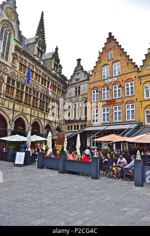 People enjoying dining in the many traditional restaurants surrounding the central square of Ypres or Ieper in Flanders, Belgium Stock Photo