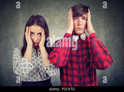 Young man and woman in misunderstanding looking upset and having conflict Stock Photo
