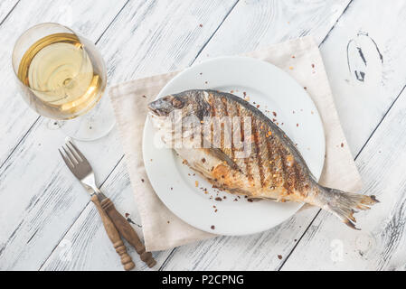 Grilled gilt-head bream on the plate Stock Photo