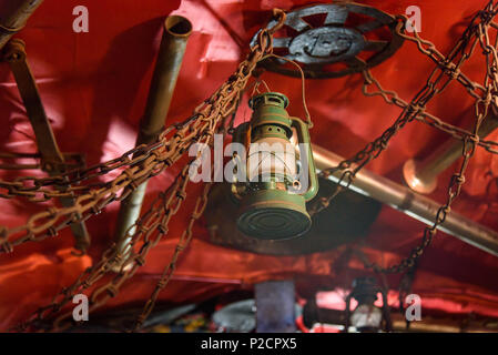 Old rusty oil lamp hanging on the ceiling Stock Photo