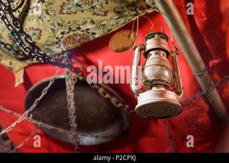 Old rusty oil lamp hanging on the ceiling Stock Photo
