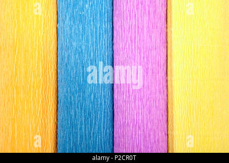 Textured backdrop from rolls of corrugated paper of different colors. Stock Photo