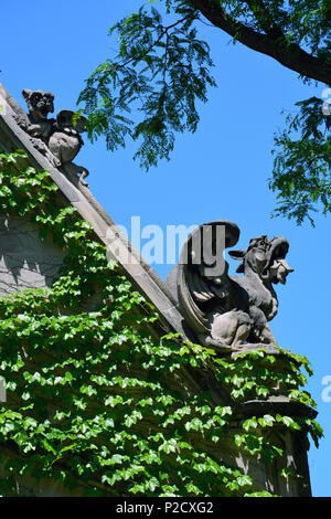 Close up of grotesques atop the iconic Cobb Gate at the University of Chicago. Stock Photo