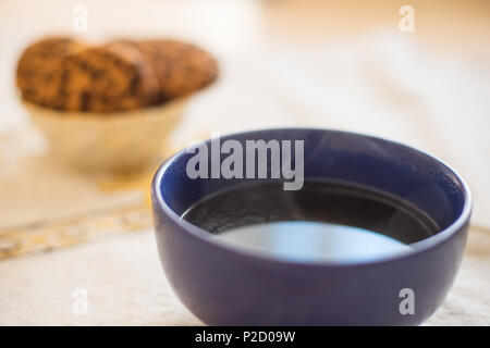 round large bowl over which steam Stock Photo