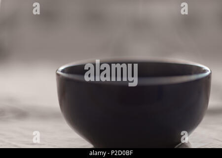 round large bowl over which steam Stock Photo