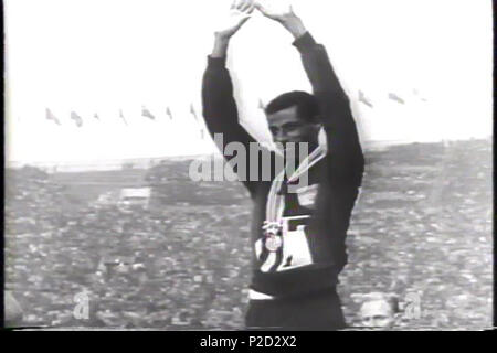 . English: Abebe Bikila with gold olympic medal on 1964 Summer Olympics in Tokyo . 1964. Universal Studios 2 Abebe Bikila 1964 Olympics Stock Photo