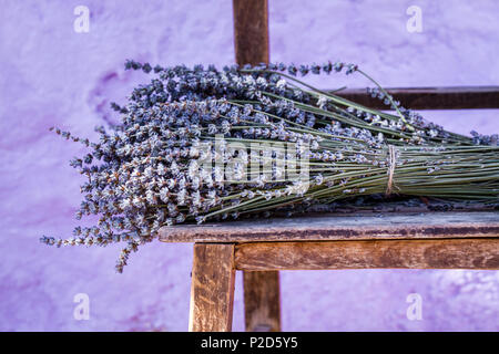 Bundle of dry lavender on authentic vintage brown table Stock Photo