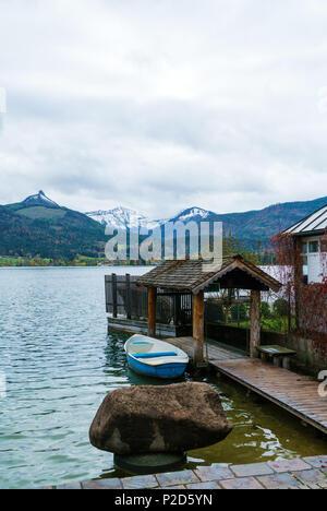 Quay on Lake Wolfgang or Wolfgangsee near St. Wolfgang town and Schafberg Alps mountain, Salzkammergut resort, Austria Stock Photo