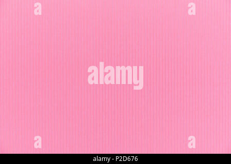 Full frame backdrop pink colored texture of corrugated  cardboard sheet. Stock Photo