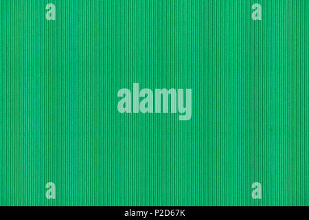 Background texture of green paper cardboard with vertical corrugated lines. Stock Photo
