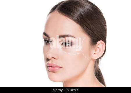 attractive young woman with dotted line drawn on face for plastic surgery isolated on white Stock Photo