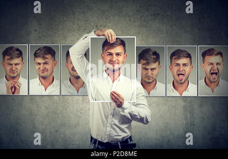 Masked young man expressing different emotions Stock Photo