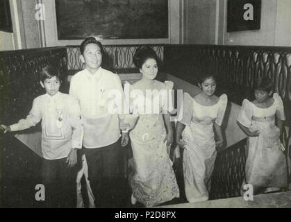 . English: Philippine President Ferdinand E. Marcos and the First Family ascending the main Palace staircase on the day of his 1969 inaugural. 1 September 2004, 15:08:14. Malacañang Palace archives 43 President Ferdinand E. Marcos and the First Family ascending the main Palace staircase on the day of his 1969 inaugural Stock Photo