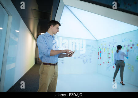 Male executive using digital tablet Stock Photo