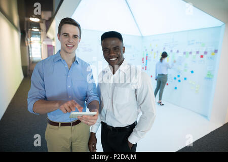 Portrait of male executives using digital tablet Stock Photo