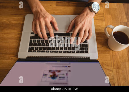 Man using his laptop Stock Photo