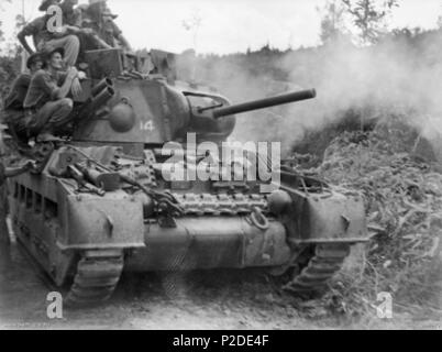 . Australian War Memorial (AWM) catalog number 089970 A Matilda II tank of the Australian 2/9th Armoured Regiment firing its three inch howitzer at Japanese positions during the Battle of Tarakan . 20 May 1945. Australian military 33 Matilda II Tarakan (089970) Stock Photo