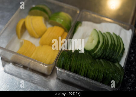 Sliced vegetables kept on kitchen counter Stock Photo
