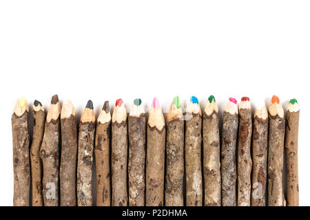 Close up of handmade wooden color pencils on white background. Stock Photo