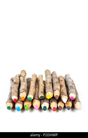 Close up of handmade wooden color pencils on white background. Stock Photo