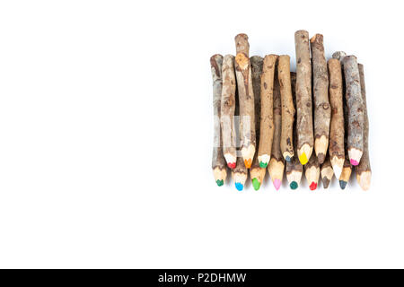 Close up of handmade wooden color pencils on white background. Stock Photo