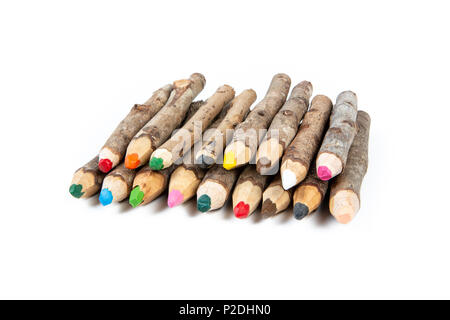 Close up of handmade wooden color pencils on white background. Stock Photo