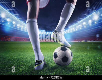 Soccer player with soccerball at the stadium ready for the match Stock Photo