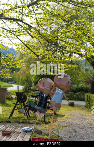 Bride and groom balloons abandoned at the end of wedding party Stock Photo