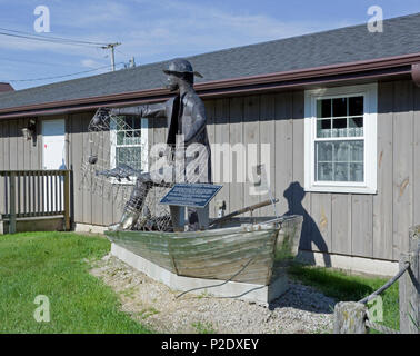 Sculpture commemorating historic fishing industry at Rogers Street Fishing Village & Museum and Great Lakes Coast Guard Museum in Two Rivers, WI Stock Photo