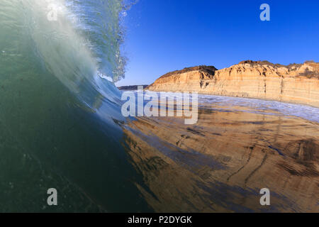 Green waves and blue sky at Torrey Pines State Beach in San Diego, California. Stock Photo