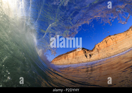Green waves and blue sky at Torrey Pines State Beach in San Diego, California. Stock Photo