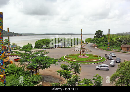 Panjim, Goa, India - July 30, 2017: Divja traffic roundabout that features Divja sculptures and nine Breda Pillars, with Mandovi River as backdrop. Stock Photo