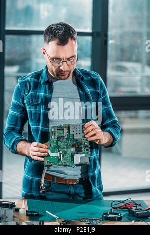 electrical engineer checking a pc Stock Photo - Alamy