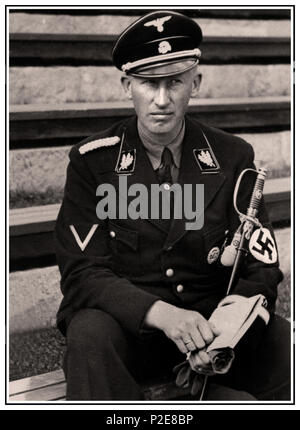 1940 HEYDRICH WAFFEN SS NAZI Reinhard Tristan Eugen Heydrich was a high-ranking German Nazi official during World War II, and a main architect of the Holocaust. He was an SS-Obergruppenführer und General der Polizei as well as chief of the Reich Main Security Office. One of Adolf Hitler’s trusted and favoured officers. Assassinated by self sacrificing courageous Czech Resistance fighters 4 June 1942, Prague, Czech Republic Stock Photo