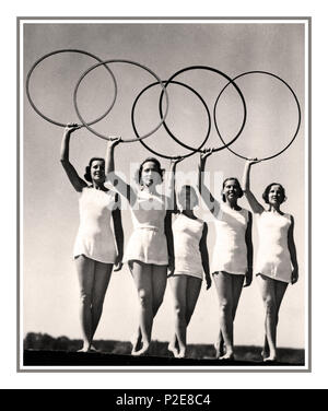 1936 Olympic Games, Berlin, Germany The Olympic Rings held aloft by five young sportswomen 1936 SUMMER OLYMPICS, BERLIN,  photo card showing blond aryan dancers with the Olympic rings, BERLIN Olympic Stadium  AUGUST 13th 1936 Germany Stock Photo